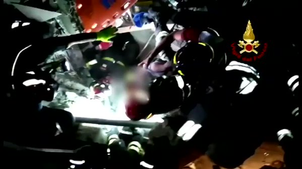 The Italian fire brigade rescued a baby from rubble after an earthquake struck the island of Ischia last night